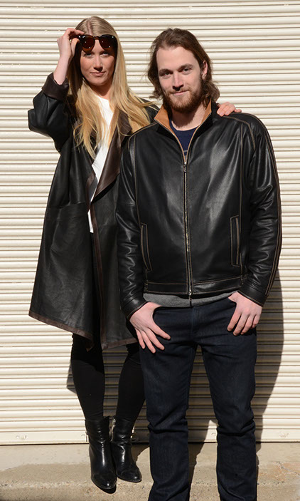 couple of models wearing leather coats couple of models wearing black leather coats