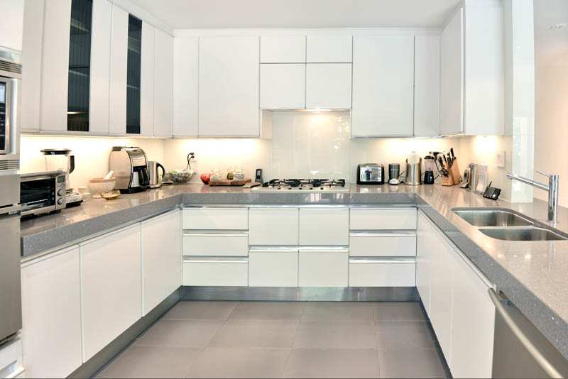 gleaming white kitchen cooking area 