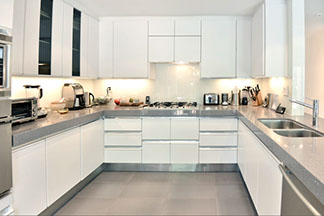 gleaming white kitchen cooking area 