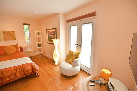 guest bedroom with balcony doors