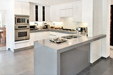 kitchen island in granite and stainless steel