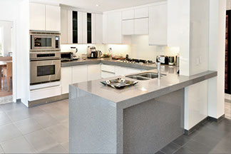 kitchen island in granite and stainless steel