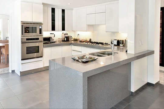 kitchen island in granite and stainless steel