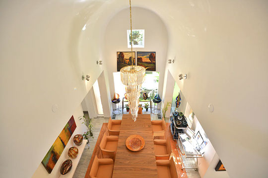 dining room, art and chandelier from balcony 