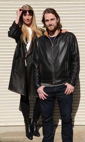 couple of models wearing black leather coats