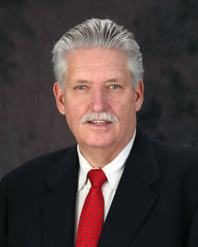 portrait of man with a red tie