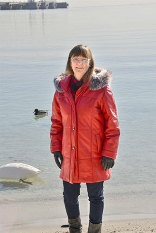 Model in red coat with hood down