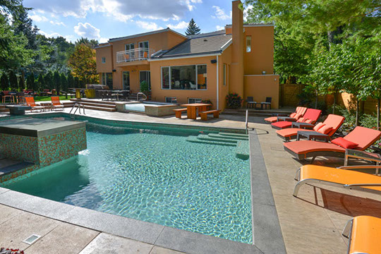 pool with lounges and hot tub 