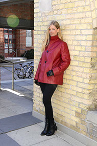 model wearing red leather coat